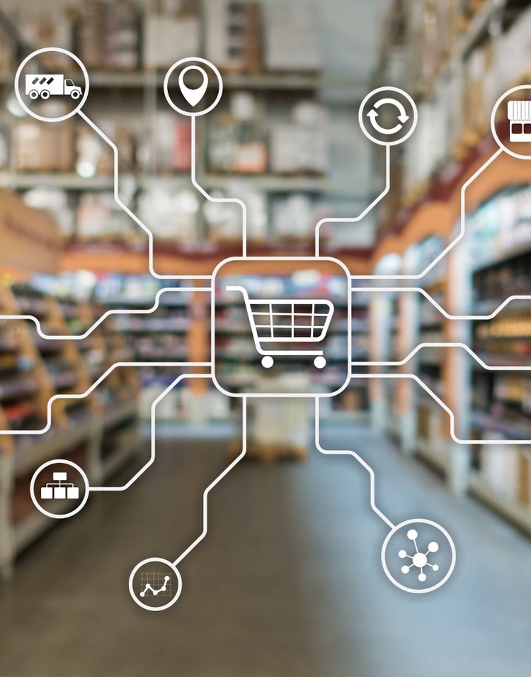 Shopping cart icon connected to various commerce symbols over a blurred store aisle background